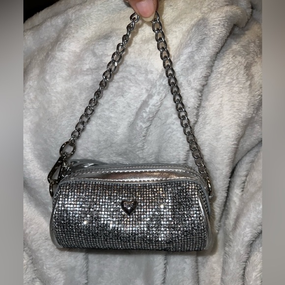 Juicy Couture Handbags - Small silver barrel style juicy couture coin bag